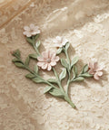 Decorative floral brooch on a lace background