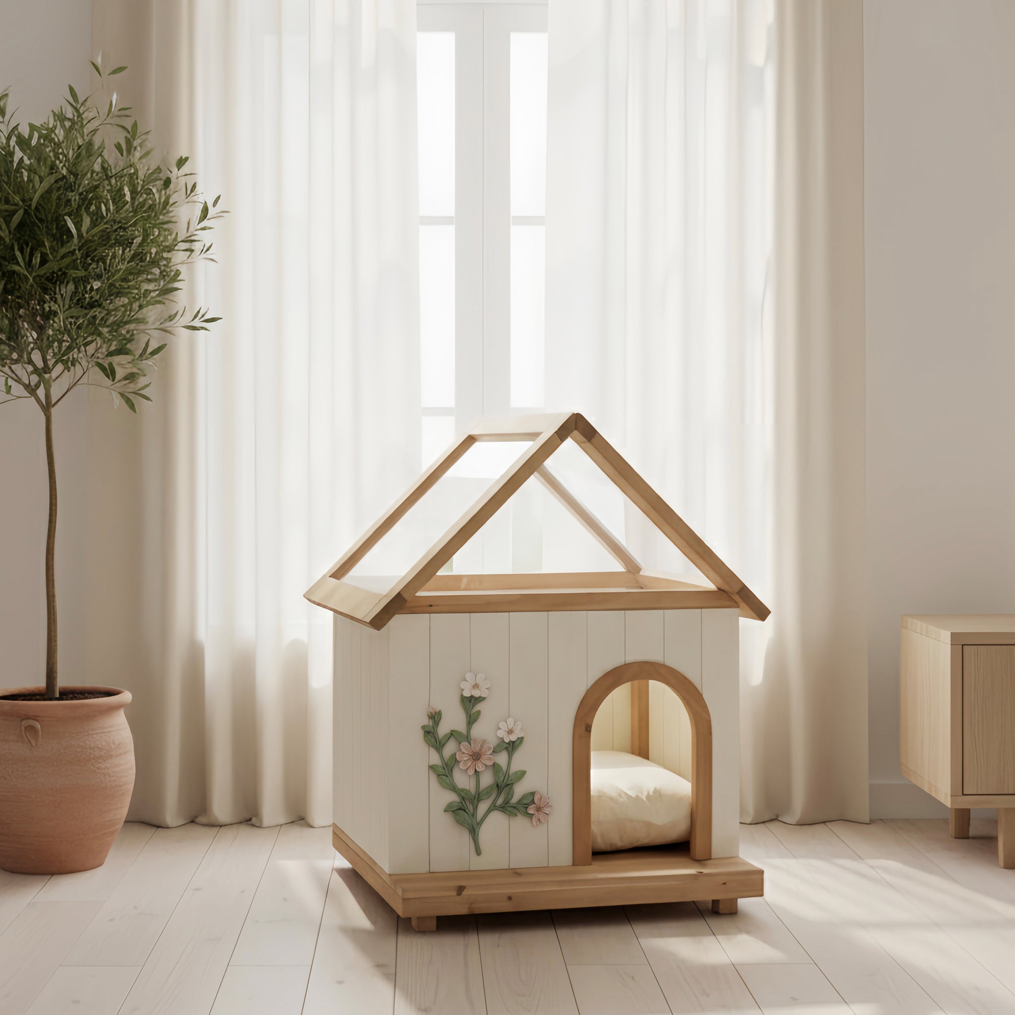 Wooden pet house with floral design on a light wooden floor with a plant and curtain in the background